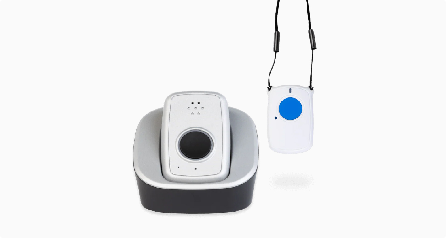Photo of a white medical alert device hub and wearable necklace.