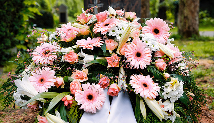 A bouquet of pink and white funeral flowers