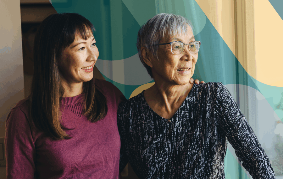 Young and senior East Asian woman smiling and looking out the window