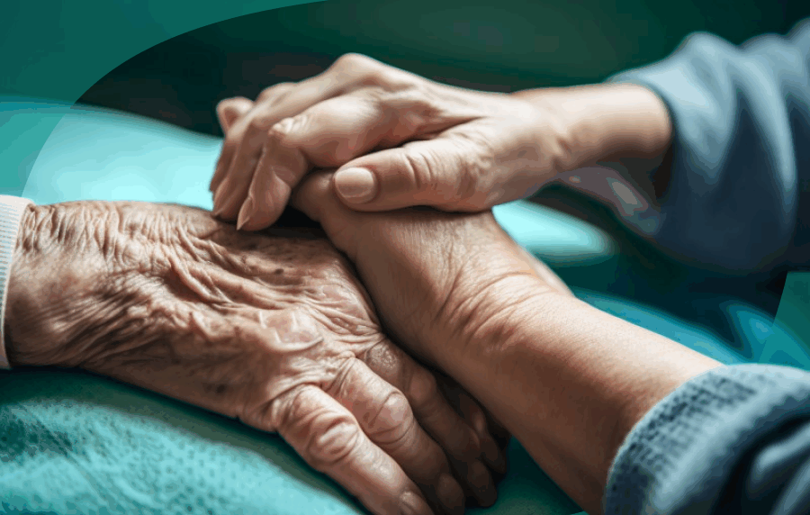 Close-up up white adult hands sitting on top of a white elderly person's hand