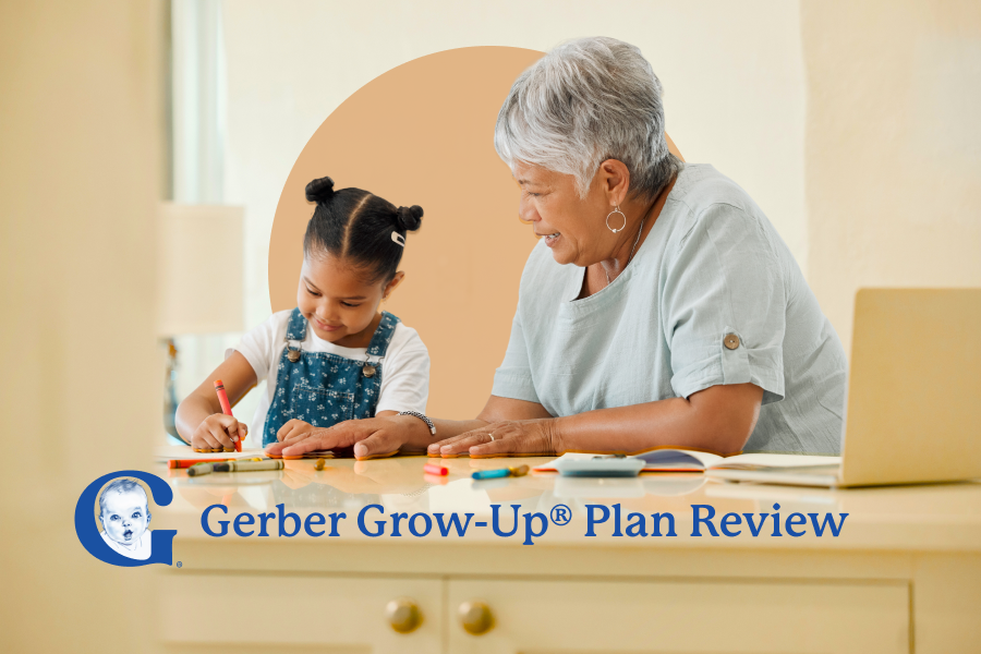 Black senior woman helping young Black girl with her coloring at a table. Gerber logo is overlaid.
